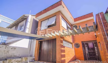 Casa com 4 quartos à venda na Rua Eudoro Berlink, 482, Auxiliadora, Porto Alegre, 214 m2 por R$ 1.500.000