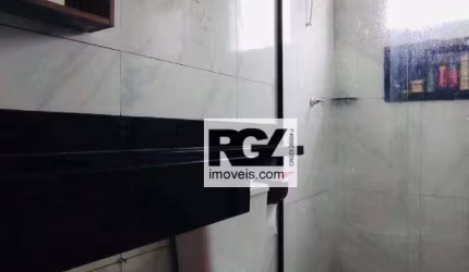 Sobrado triplex com 2 dormitórios à venda, 145 m² por R$ 580.000 - Vila Voturuá - São Vicente/SP