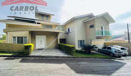 CONDOMÍNIO ARAUCÁRIA - 4 DORMS. (SUÍTE) - 6 VAGAS - AT 580m² - AC 400m² -