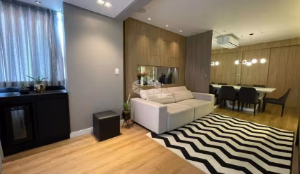 Apartamento com uma linda vista para o mar de  2 dormitórios, sendo 1 suíte, 2 vagas de garagem no bairro Coqueiros em Florianópolis/SC.