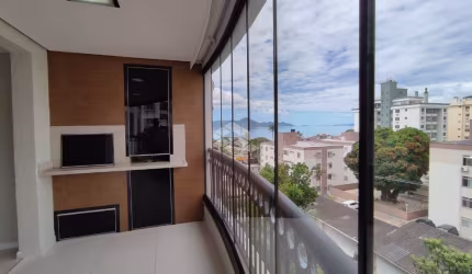APARTAMENTO COM VISTA MAR SEMIMOBILIADO COM 3 QUARTOS SENDO 1 SUÍTE 2 VAGAS DE GARAGEM NO BAIRRO COQUEIROS EM FLORIANÓPOLIS/SC