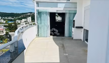 COBERTURA COM 3 QUARTOS SENDO 1 SUÍTE 2 VAGAS DE GARAGEM E VISTA PANORÂMICA EM FLORIANÓPOLIS