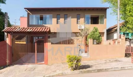 Casa com 4 quartos à venda na Rua Adroaldo Novo Correa, 126, Cavalhada, Porto Alegre por R$ 650.000