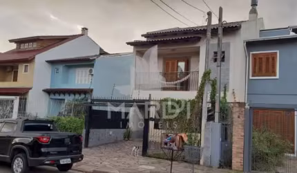 Casa com 3 quartos à venda na Rua Attilio Bettio, 92, Aberta dos Morros, Porto Alegre por R$ 580.000
