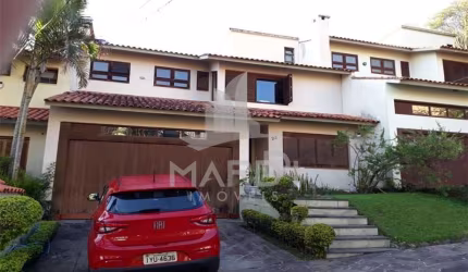 Casa em condomínio fechado com 4 quartos à venda na Praça São Caetano, 90, Teresópolis, Porto Alegre por R$ 1.200.000
