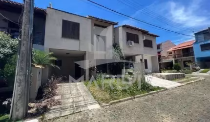 Casa em condomínio fechado com 3 quartos para alugar na Rua Ponciano Pacheco da Silveira, 172, Guarujá, Porto Alegre por R$ 2.200