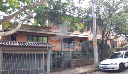 Casa com 4 quartos à venda na Rua Fonseca Guimarães, 34, Medianeira, Porto Alegre por R$ 1.600.000