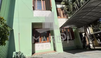 Casa em condomínio fechado com 3 quartos à venda na Avenida Juca Batista, 4115, Hípica, Porto Alegre por R$ 425.000