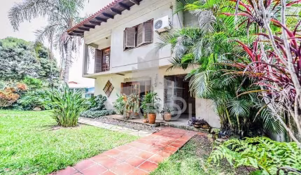Casa em condomínio fechado com 4 quartos à venda na Acesso das Orquídeas, 93, Santa Tereza, Porto Alegre por R$ 520.000