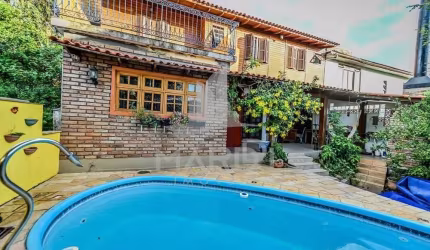 Casa em condomínio fechado com 4 quartos à venda na das Figueiras, 108, Santa Tereza, Porto Alegre por R$ 650.000