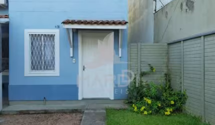 Casa em condomínio fechado com 2 quartos à venda na Rua Alcebíades Ribeiro, 48, Hípica, Porto Alegre por R$ 220.000