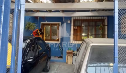 Casa com 5 quartos à venda na Rua Delmar Kuhn, 75, Hípica, Porto Alegre por R$ 450.000