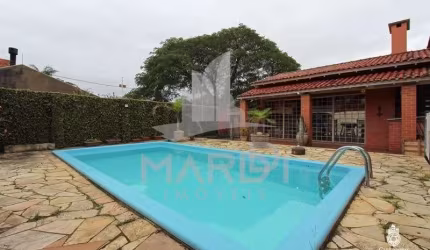 Casa com 3 quartos à venda na Avenida Guarujá, 70, Guarujá, Porto Alegre por R$ 599.000
