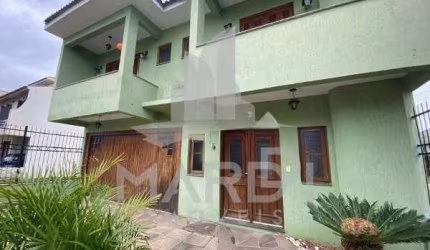 Casa em condomínio fechado com 3 quartos à venda na Rua Louro, 34, Hípica, Porto Alegre por R$ 680.000