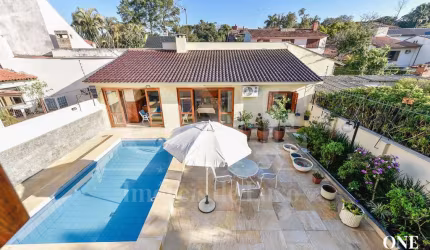 Casa em condomínio fechado com 5 quartos à venda na Avenida Pereira Passos, 239, Vila Assunção, Porto Alegre por R$ 2.450.000