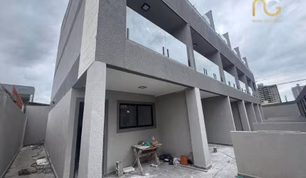 Sobrado com 3 dormitórios à venda, 121 m² por R$ 690.000,00 - Caiçara - Praia Grande/SP