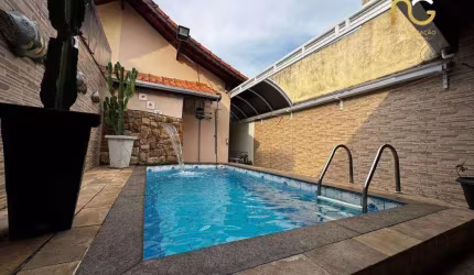 Casa com 3 dormitórios à venda, 160 m² por R$ 850.000,00 - Tupi - Praia Grande/SP