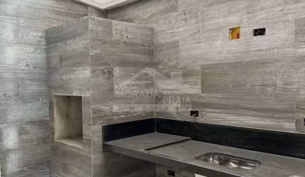 Residencial em CONDOMÍNIO FECHADO, 2 dormitórios com 2 suítes na Guilhermina ( Praia Grande ).