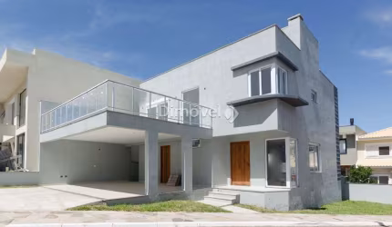 Casa em condomínio fechado com 3 quartos à venda na Rua Ivo Walter Kern, 599, Hípica, Porto Alegre por R$ 1.100.000