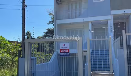 Casa com 3 quartos à venda na Rua Claudio da Silva Pinto, 608, Guarujá, Porto Alegre por R$ 595.000