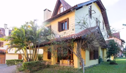 Casa em condomínio fechado com 3 quartos à venda na Rua Luís Felipe Monmany, 101, Guarujá, Porto Alegre por R$ 650.000