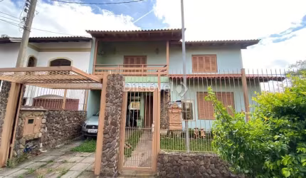 Casa com 4 quartos à venda na Rua Mário Assumpção, 15, Guarujá, Porto Alegre por R$ 750.000