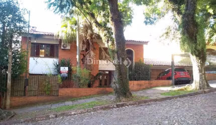 Casa com 4 quartos à venda na Rua Itapitocaí, 128, Cristal, Porto Alegre por R$ 780.000