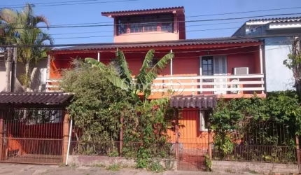 Casa com 4 quartos à venda na Rua Vinte e Um de Agosto, 183, Cavalhada, Porto Alegre por R$ 550.000