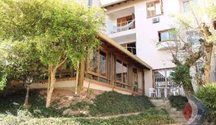 Casa com 3 quartos à venda na Rua Edgar Luiz Schneider, 55, Jardim Isabel, Porto Alegre por R$ 900.000