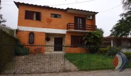 Casa com 3 quartos à venda na Rua Jacundá, 670, Guarujá, Porto Alegre por R$ 570.000