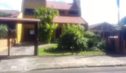 Casa em condomínio fechado com 4 quartos à venda na Rua Fernando Ferrari, 449, Piratini, Sapucaia do Sul por R$ 750.000