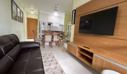 APARTAMENTO NA PRAIA GRANDE com 2 dormitórios sendo 1 suíte,1 vaga de garagem,varanda gourmet com churrasqueira,sala 2 ambientes