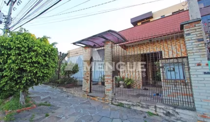 Casa com 5 quartos à venda na Rua Umbú, 566, Passo da Areia, Porto Alegre por R$ 1.500.000