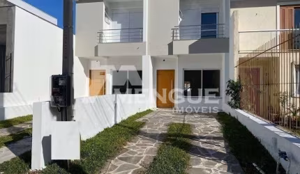 Casa com 3 quartos à venda na Rua Itacyr Rossi, 190, Guarujá, Porto Alegre por R$ 499.000