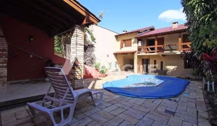 Casa com 3 quartos à venda na Rua Francisca Lechner, 343, Parque Santa Fé, Porto Alegre por R$ 650.000