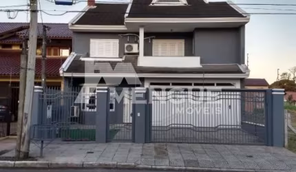 Casa com 3 quartos à venda na Rua Hugo Nelson Magalhães, 280, Parque Santa Fé, Porto Alegre por R$ 958.000