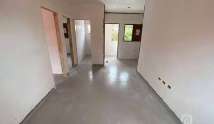 Village com 2 dormitórios à venda, 51 m² por R$ 330.000 - Indaiá - Bertioga/SP