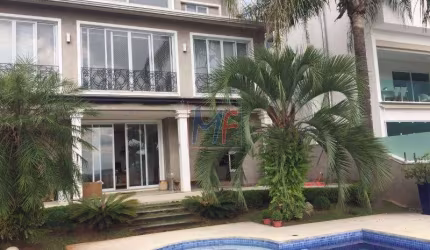 REF 10.399 Excelente Casa em Alphaville, sendo 4 suítes todas com Ar Condicionado, área gourmet, piscina, salas, 600 m² útil, 700 m² terreno.
