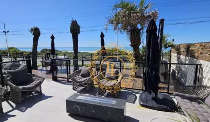 PRÉDIO FRENTE MAR NA PRAIA BRAVA -SC 03 SUÍTES 03 VAGAS
