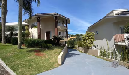 Casa em condomínio fechado com 5 quartos à venda na Estrada Haroldo Soares Glavan, Cacupé, Florianópolis por R$ 3.700.000