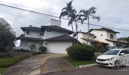 Casa em condomínio fechado com 4 quartos à venda na Estrada Haroldo Soares Glavan, Cacupé, Florianópolis por R$ 2.950.000