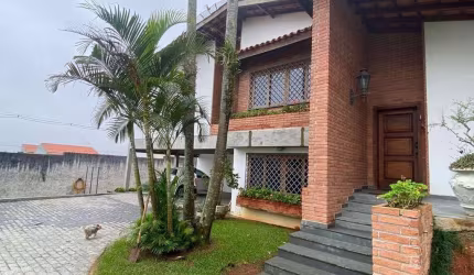 Casa com 4 dormitórios para alugar, 329 m² por R$ 16.388,32/mês - Parque do Colégio - Suzano/SP