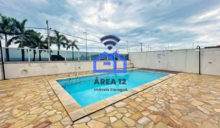 Apartamento à Venda no bairro do Massaguaçu, com 2 dormitórios e sacada com vista pro mar, banheiro