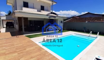 Linda casa à venda no Jardim Britânia - 4 dormitórios, sendo 2 suítes, banheiro, sala com 2 ambient