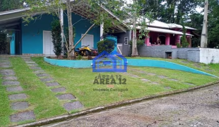 Casa à venda em Condomínio no bairro do Massaguaçu - 3 dormitórios, sendo 1 suíte, 4 banheiros, sal