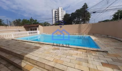 Casa à venda no bairro Jardim Aruan em Caraguatatuba, SP - 3 dormitórios sendo 1 suíte, piscina, ga
