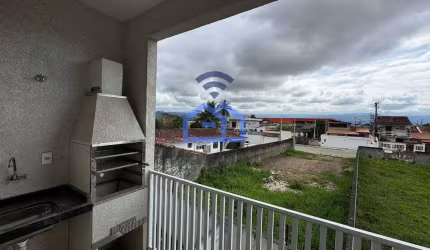 Apartamento à venda no bairro Tarumãs em Caraguatatuba, SP - 70m² com dois dormitórios, sala, cozin