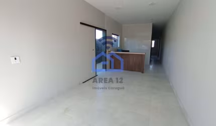 Casa à Venda no bairro Morro do Algodão em Caraguatatuba, SP - 2 dormitórios, vaga de garagem, lava