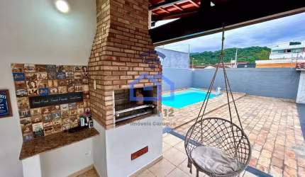 Casa ampla com 3 dormitórios à venda no bairro Estrela d'Alva, área central de Caraguatatuba - Exce