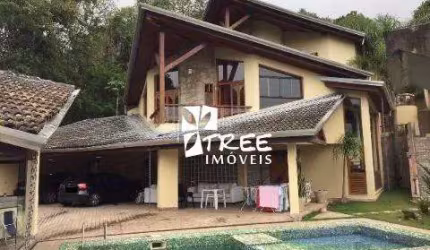 VENDA DE CASA NO CONDOMÍNIO HILLS I E II EM ARUJÁ/SP, 1000m² mobiliado c/ 5 suítes, ambientes amplos, piscina, churrasqueira e 10 vagas. CONSULTE-NOS.